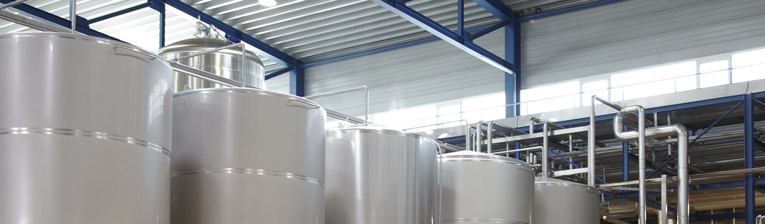 Three tanks in an industrial hall