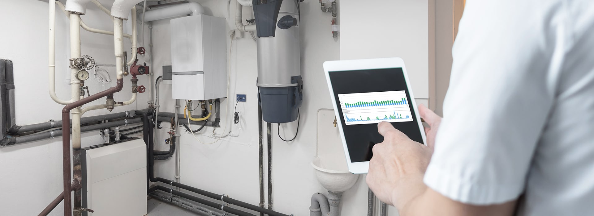 A tablet in front of a heating cellar to check temperature and humidity