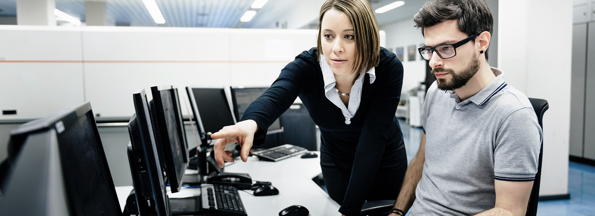 Man and woman looking at a computer screen together
