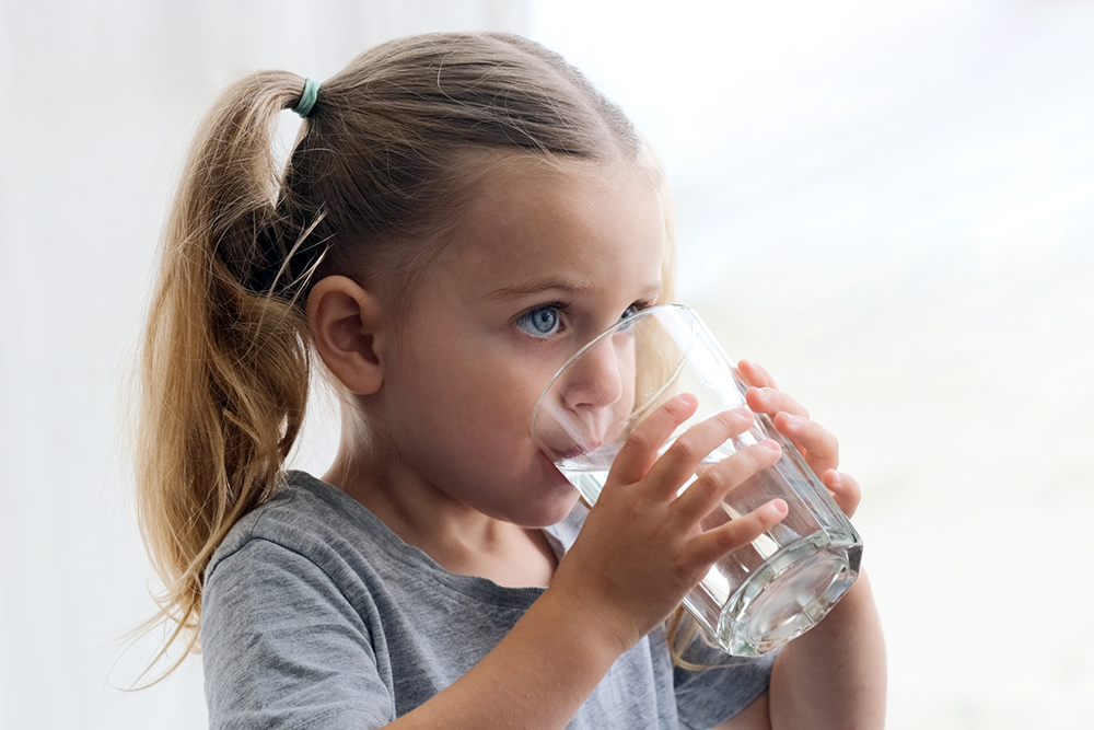 Child with a glass of water