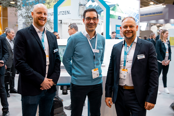 Jan-Philipp Exner and René Claussen from ZENNER together with a person from adesso at the E-world 2025