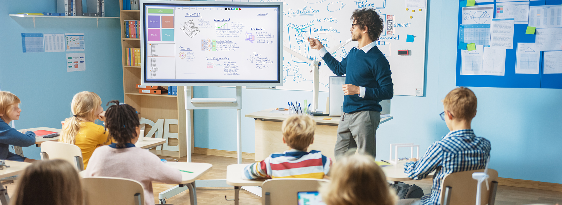 a teacher in front of a class of children