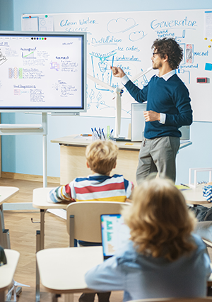 a teacher in front of a class of children