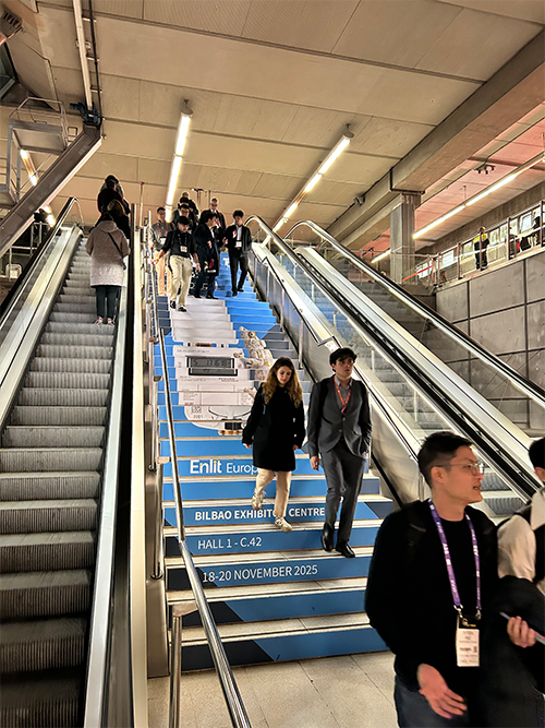 Stairs in the metrostation of Bilbao with ZENNER advertisement for B.One